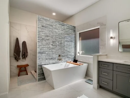 Elegant, modern "spa" master bathroom remodel in Keller, TX with blue glass accent tile