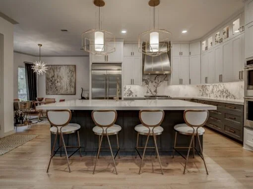 Elegant, modern kitchen remodel near Fort Worth, TX with two-toned cabinets and real wood floors